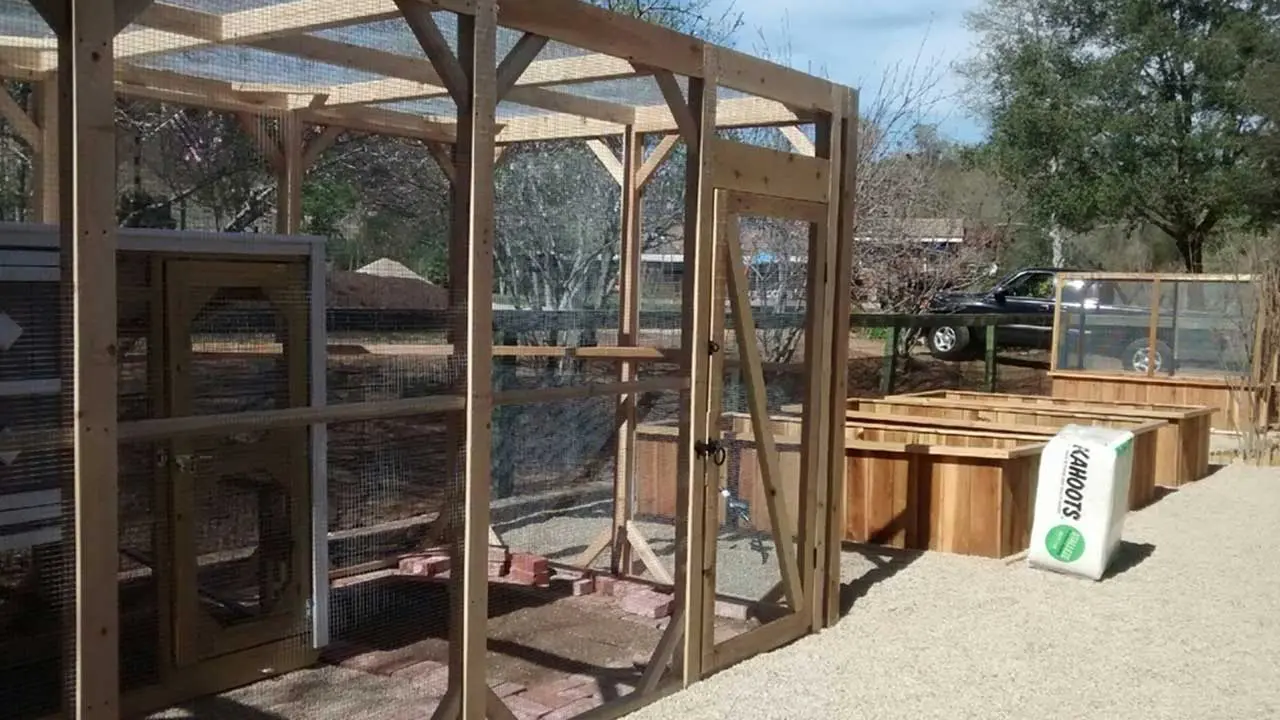A wooden structure with a glass door and some wood.