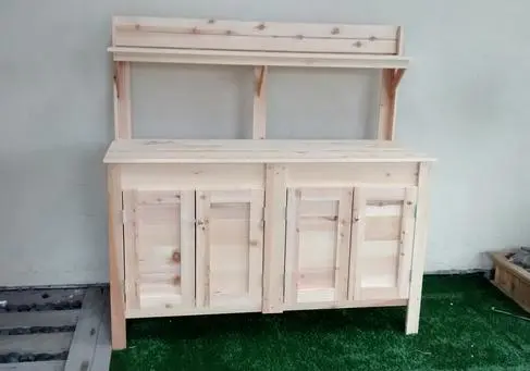 A wooden cabinet with two doors and two drawers.